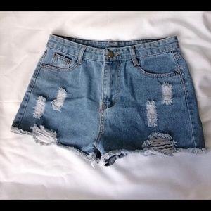 High-waisted blue raw hem distressed shorts